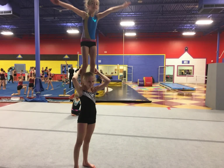 Recreational gymnastics class working through a circuit in the gym