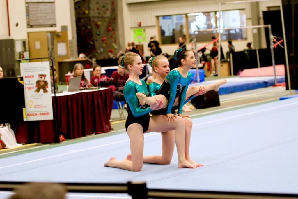 Acrobatic gymnastics partnership training a balance element in the gym