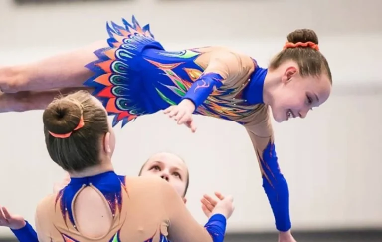 Acrobatic gymnastics partnership holding a balance skill during training at Edmonton Acrobatic Gymnastics