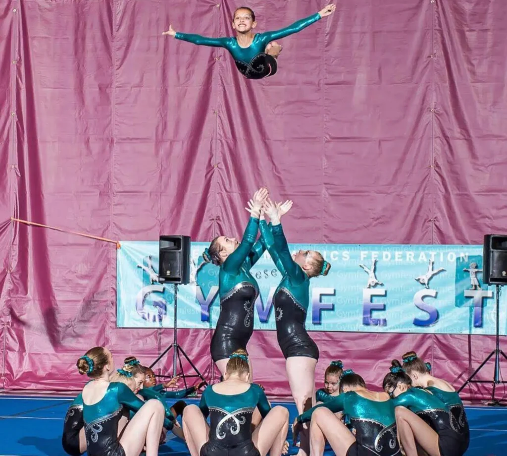 Group of Edmonton Acrobatic Gymnastics athletes performing a toss at Gymfest